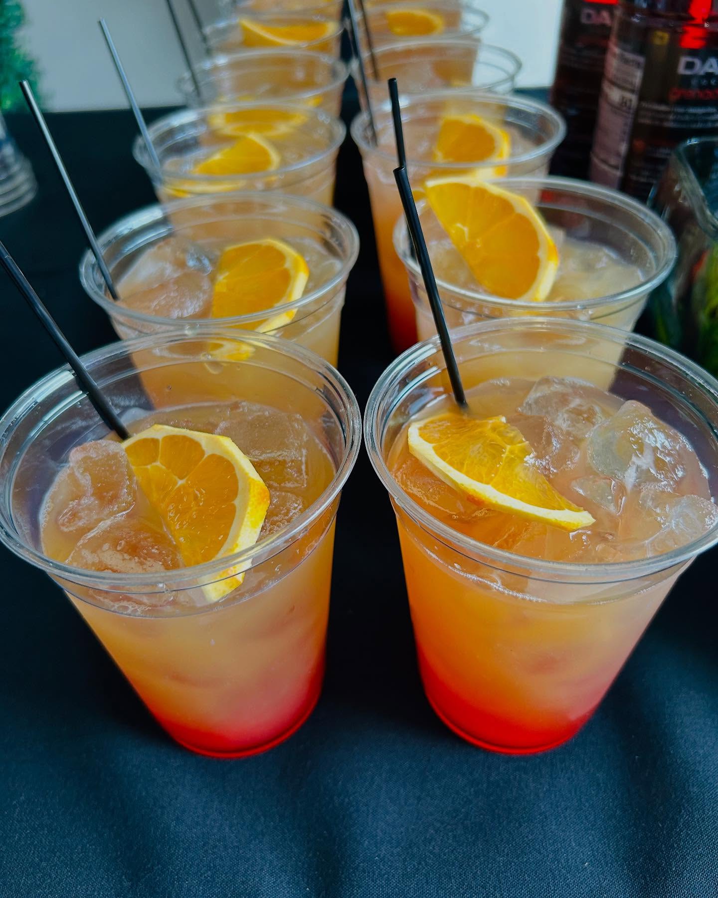 colorful cocktails with orange garnishes