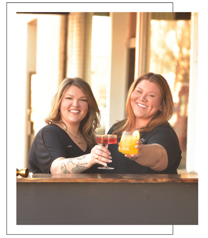 wedding bartenders toasting cocktails