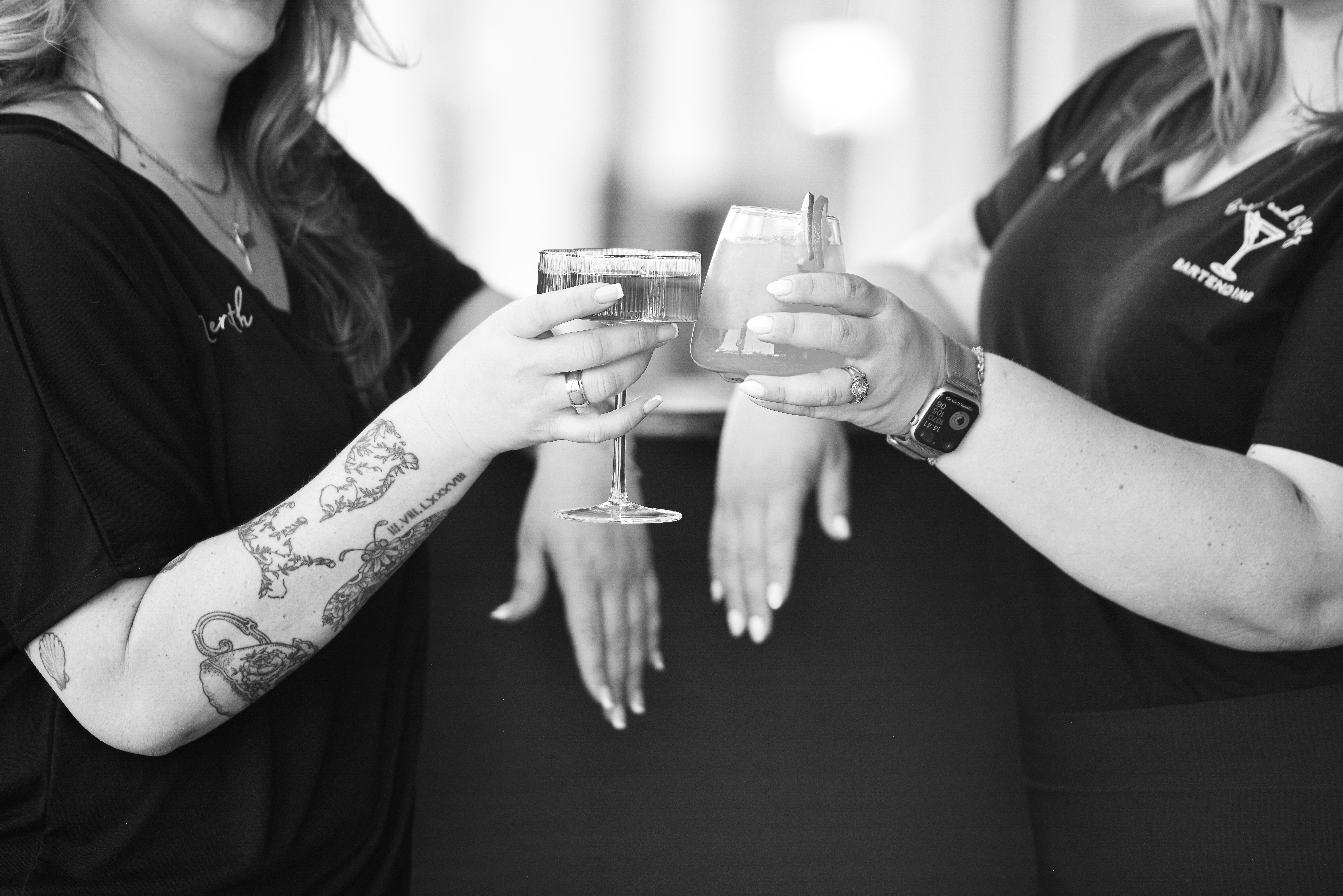 buzzin' and bubbly bartending bartenders holding cocktails